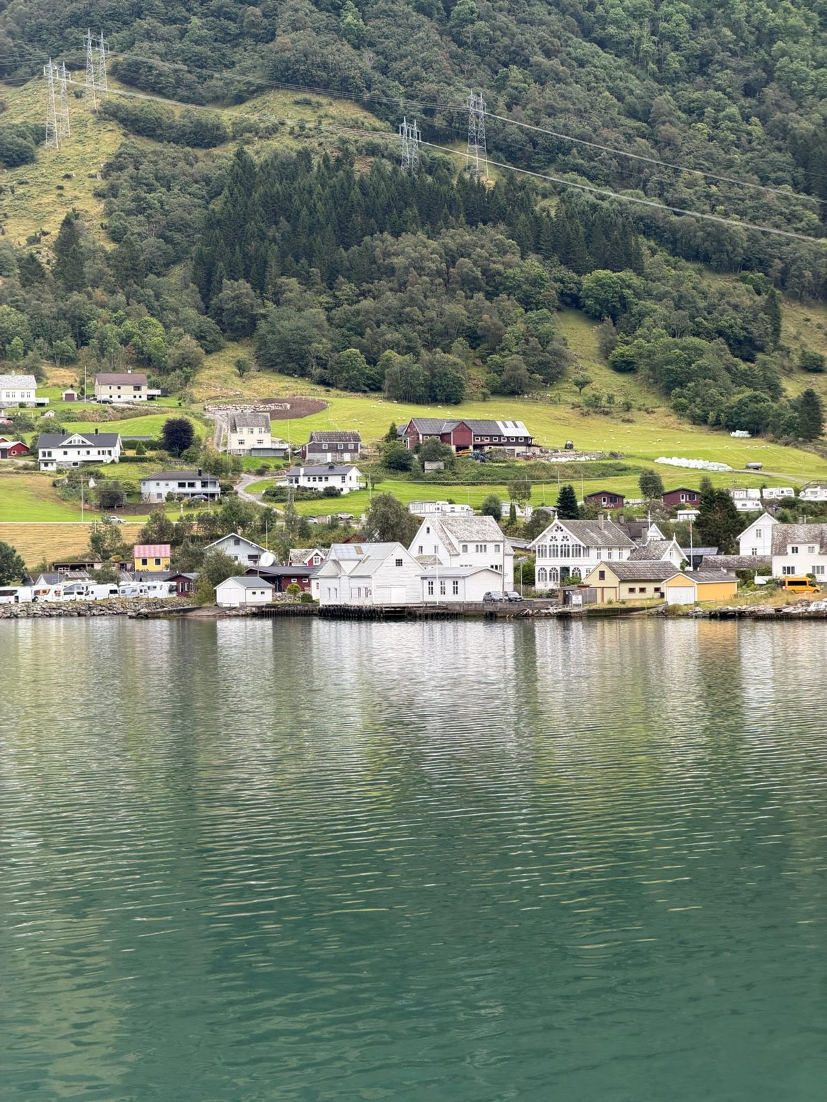 White timber houses along the shore